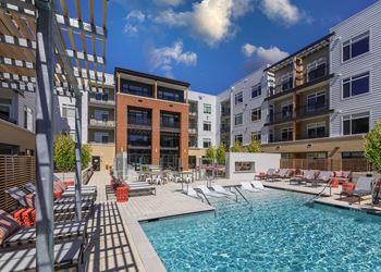 Resort-style swimming pool with water feature